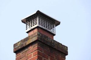 Chimney cap topper on bricks Hoschton, GA